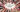 Collage coloré de rouges à lèvres longue tenue pour 2024, avec texte"Meilleurs rouge à lèvre longue durée" au centre, entouré de différentes marques et teintes de rouges à lèvres, sur un fond doux aux couleurs thématiques de cosmétiques